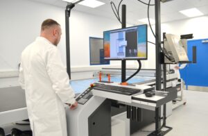 Cutting & Kitting - Zund cutting prepreg composite material in a cleanroom environment.