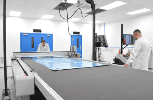 Cutting & Kitting - Zund cutting prepreg composite material in a cleanroom environment.